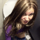 A pretty Eastern-European records herself pissing and shitting while sitting on a toilet in a public restroom. Clear plopping sounds. She uses an interesting elongated handle to hold the camera. Presented in 720P HD. About 4 minutes.
